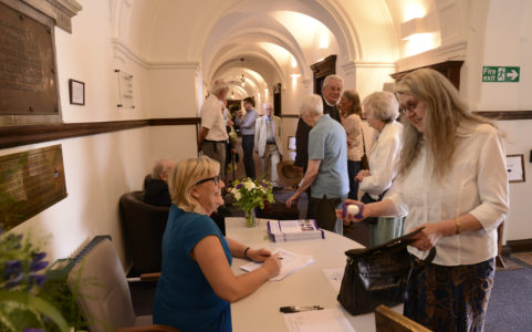 Syd welcoming guests at event